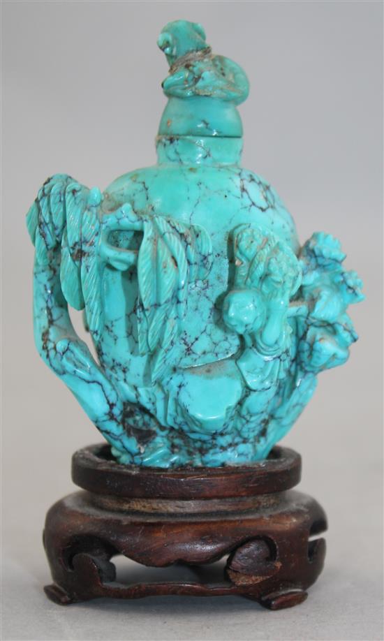 A Chinese turquoise matrix snuff bottle, late 19th / early 20th century, 6.5cm., wood stand, repair to cover